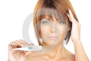 Unhappy woman with thermometer