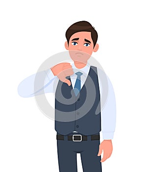 Unhappy young businessman in waistcoat showing thumb down gesture. Person making symbol of dislike or bad sign. Male character. photo