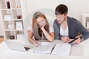 Unhappy young couple in financial trouble