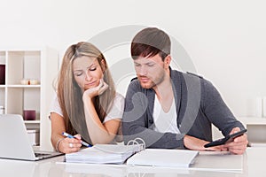Unhappy young couple in financial trouble