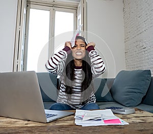 Unhappy young female in stress banking and accounting debt bill bank papers expenses and payments