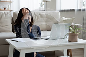 Unhappy young korean woman feeling stressed about not enough money.