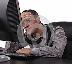 Unhappy Young Man in Front of the Computer