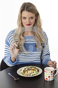 Unhappy Young Woman Eating Mixed Vegetables Meal