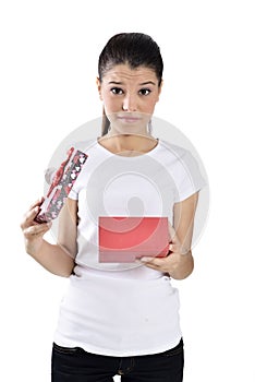 Unhappy young woman with gift boxes