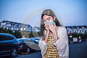 Unhealthy Asian woman sneezing and cough with protective face mask to protect Coronavirus or Covid-19 disease