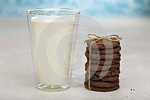 UnHealthy breakfast milk shake and a stack of chocolate chip cookies. close up