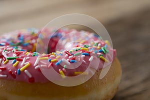 Unhealthy but delicious sweet sugar donut cake on vintage wooden table in lifestyle nutrition health care