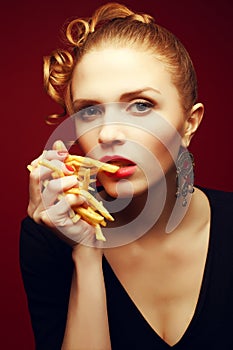 Unhealthy eating. Junk food concept. Girl with fries