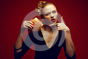 Unhealthy eating. Junk food concept. Guilty pleasure. Woman with burger