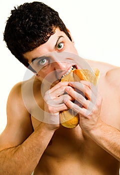 Unhealthy food - hungry man eating bread