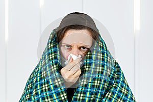 Unhealthy woman wearing medical mask, blowing nose into tissue. have flu, virus. corona virus covid-19 concept, isolated