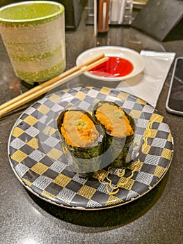 Uni Sushi served on plate with wasabi