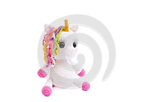 Unicorn crochet plush doll isolated on white background.