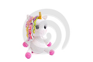Unicorn crochet plush doll isolated on white background. photo
