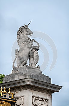 Unicorn statue on gate pillar at Buckingham Palace, London, UK