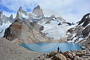 Unidentified backpacker looking at the Fitz Roy peak in Los Glaciares National Park, El ChaltÃÂ©n, Argentina photo