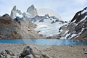 Unidentified backpackers in front of the Fitz Roy peak in Los Glaciares National Park, El ChaltÃÂ©n, Argentina photo