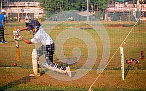 Unidentified boy practicing batting to improve cricketing skills at Mumbai ground