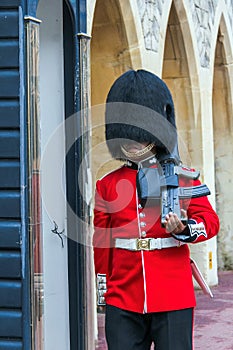 Unidentified British Queen's Guard marching on duty inside Windsor Castle