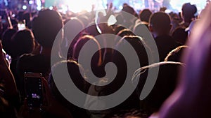 Unidentified crowed people having fun in music concert festival