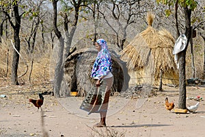 Unidentified Fulani woman stands in the bational clothes in the