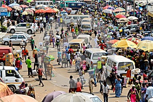 Unidentified Ghanaian people buy and sell goods at the Kumasi m