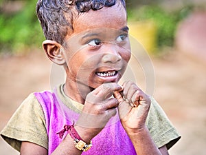 Unidentified indian dalit shy cute boy in the street. Children of Tamil Nadu suffer of poverty