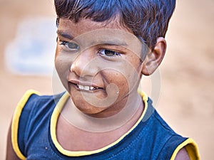 Unidentified indian dalit shy cute boy in the street. Children of Tamil Nadu suffer of poverty