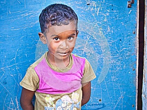 Unidentified indian dalit shy cute boy in the street. Children of Tamil Nadu suffer of poverty