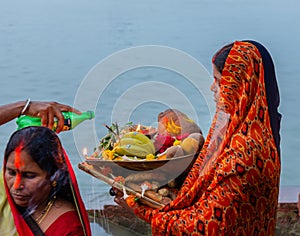An unidentified Indian woman praying.
