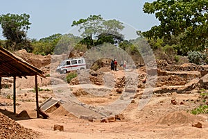 Unidentified local people collect clay for building houses.