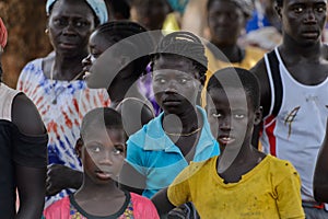 Unidentified local people stand in the Etigoca village. People