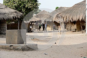 Unidentified local woman walks along the street in the Etigoca