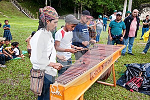 Unidentified Mayan people playing percussion in Tikal, Guatemal