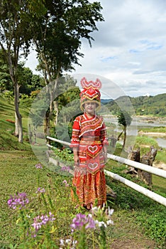 Unidentified Mong tribe young woman with traditional clothes
