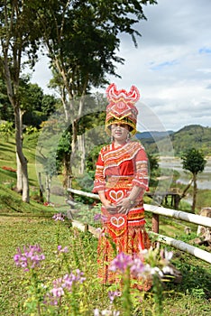 Unidentified Mong tribe young woman with traditional clothes and