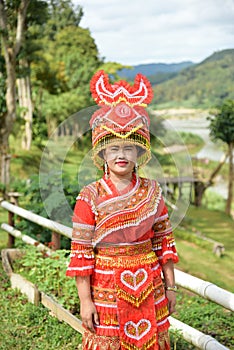 Unidentified Mong tribe young woman with traditional clothes and