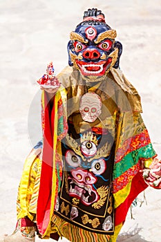 Unidentified monk performs a religious masked and costumed mystery dance of Tibetan Buddhism