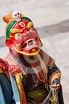 Unidentified monk performs a religious masked and costumed mystery dance of Tibetan Buddhism