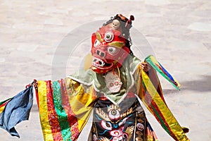 Unidentified monk performs a religious masked and costumed mystery dance of Tibetan Buddhism