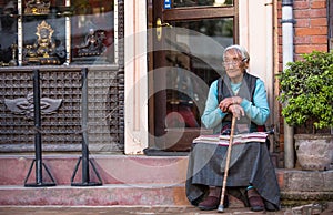Unidentified old woman near Boudhanath, Nov 30, 2013 in Kathmandu, Nepal.