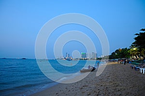 Unidentified People Along Pattaya Beach at Sunset