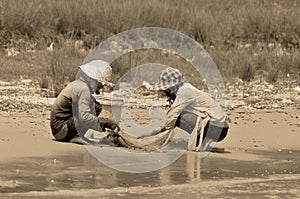 Unidentified people fishing in the Tonle sap River