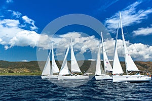 Unidentified sailboats participate in sailing regatta among Greek island group in the Aegean Sea