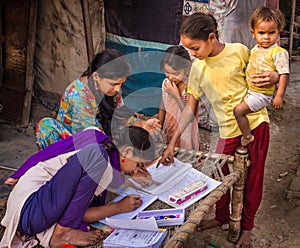 Unidentified school girls of Indian Ethnicity busy doing homework