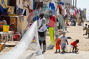 Unidentified Senegalese man holds a fishing net at the local ma