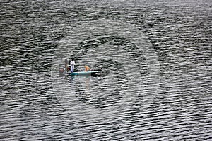 Unidentified three men are fishing