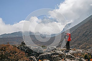 Unidentified tourist trekking in nepal walking from dingboche to chukung within sagarmatha national park on everest base camp