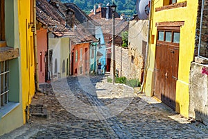 Unidentified tourists walking in historic town Sighisoara. City in which was born Vlad Tepes,